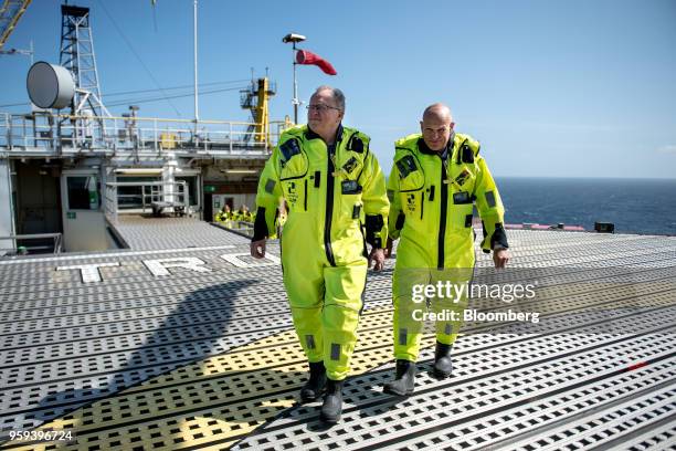 Arne Sigve Nylund, head of development and production in Norway for Equinor ASA, left, and Eldar Saetre, chief executive officer of Equinor ASA, walk...