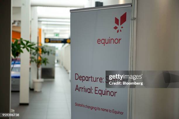 Sign with the new Equinor ASA logo stands at an airport in Stavanger, Norway, on Wednesday, May 16, 2018. Statoil has changed its name to Equinor to...