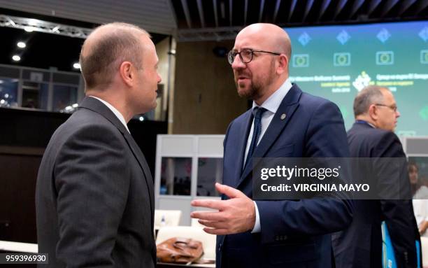 Belgian Prime Minister Charles Michel speaks with Malta's Prime Minister Joseph Muscat during a round table meeting of EU and Western Balkan heads of...