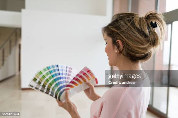 woman working on a housing project - home design colors stock pictures, royalty-free photos & images