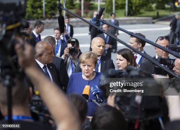 Angela Merkel, Germany's chancellor, pauses while making a statement to journalists as she arrives for a summit of European Union leaders in Sofia,...