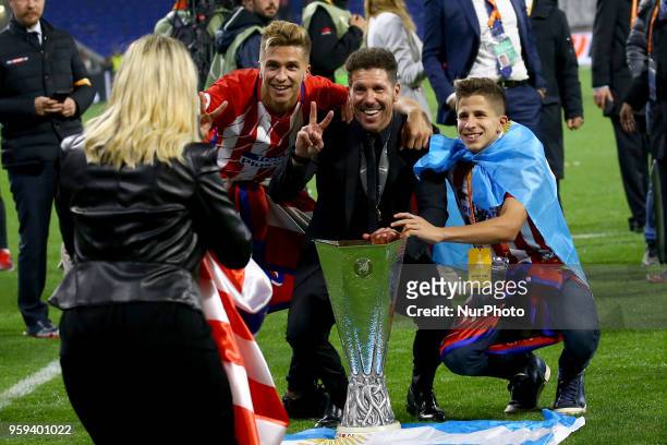 Diego Simeone manager of Atletico with the sons Giuliano and Gianluca posing with the trophy at Groupama Stadium in Lyon, France on May 16, 2018...