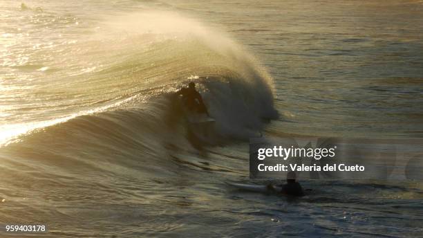surfers on the water, meeting in the ipanema sea - valeria del cueto stock pictures, royalty-free photos & images