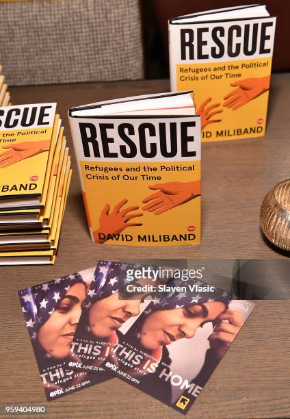 The books "Rescue, Refugees and the Political Crisis of Our Time" by David Miliband on display during "This is Home: A Refugee Story" - New York...