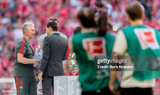 Christian Seifert , CEO of the DFL congratulates Head coach Jupp Heynckes of FC Bayern Muenchen after the Bundesliga match between FC Bayern Muenchen...