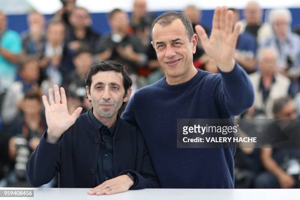 Italian actor Marcello Fonte and Italian director Matteo Garrone pose on May 17, 2018 during a photocall for the film "Dogman" at the 71st edition of...