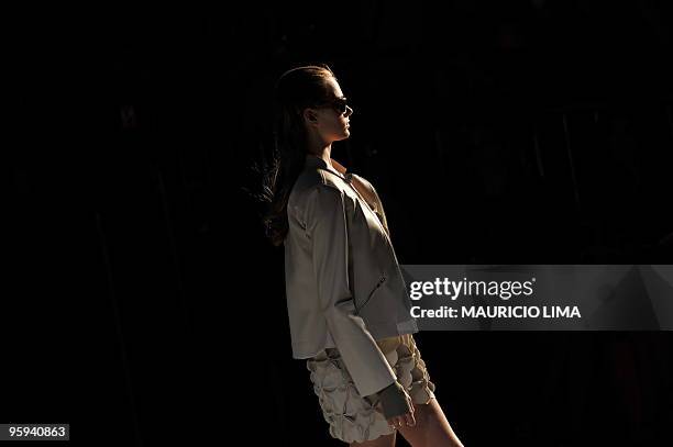 Model presents a creation by designer Carlota Joaquina as part of the 2010-2011 Fall-Winter collections of the Sao Paulo Fashion Week, in Sao Paulo,...
