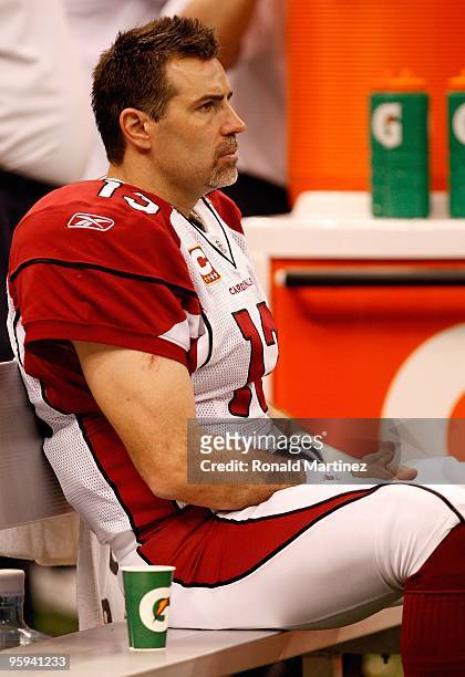 Quarterback Kurt Warner of the Arizona Cardinals looks on dejected from the bench in the second half against the New Orleans Saints during the NFC...
