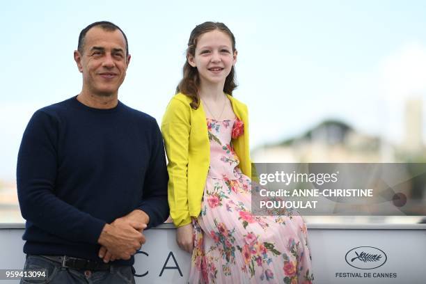 Italian director Matteo Garrone and Italian actress Alida Baldari Calabria pose on May 17, 2018 during a photocall for the film "Dogman" at the 71st...