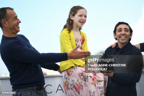 Italian director Matteo Garrone, Italian actress Alida Baldari Calabria and Italian actor Marcello Fonte pose on May 17, 2018 during a photocall for...