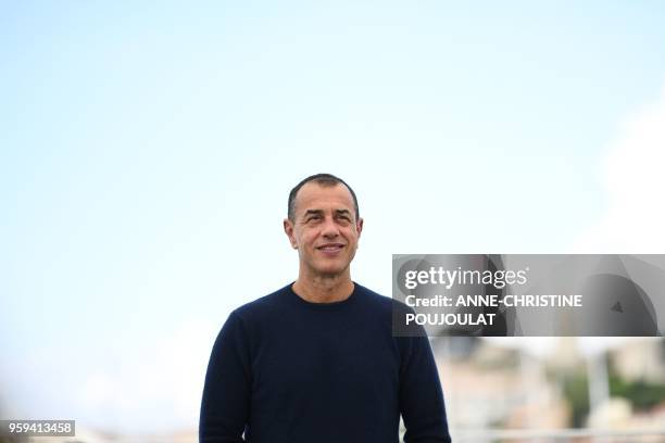 Italian director Matteo Garrone poses on May 17, 2018 during a photocall for the film "Dogman" at the 71st edition of the Cannes Film Festival in...