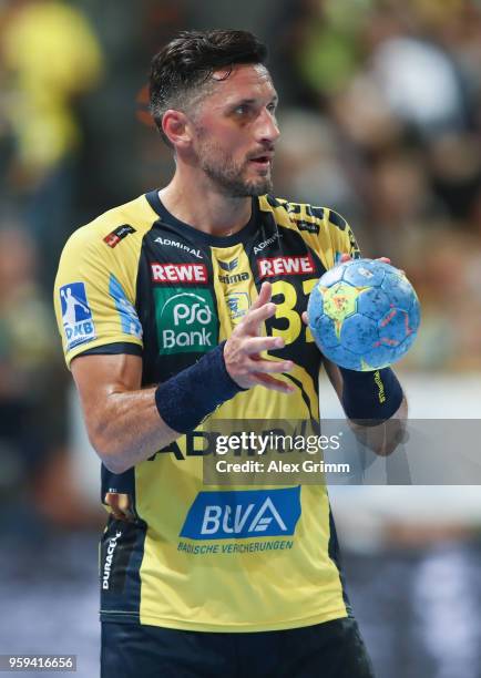 Alexander Petersson of Rhein-Neckar Loewen controls the ball during the DKB HBL match between Rhein-Neckar Loewen and SC Magdeburg at SAP Arena on...