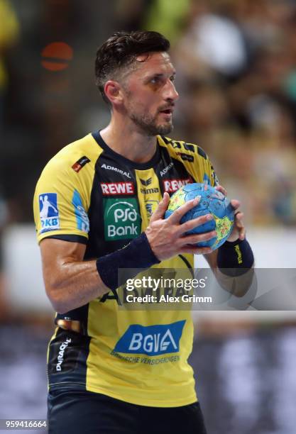 Alexander Petersson of Rhein-Neckar Loewen controls the ball during the DKB HBL match between Rhein-Neckar Loewen and SC Magdeburg at SAP Arena on...