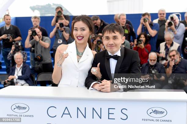 Actress Dinara Baktybaeva and director Adilkhan Yerzhanov attends "The Gentle Indifference Of The Word" Photocall during the 71st annual Cannes Film...