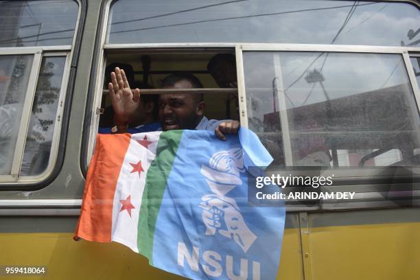 An Indian National Congress supporter shouts slogans during a protest rally against the decision of demolition of party's offices across the state in...