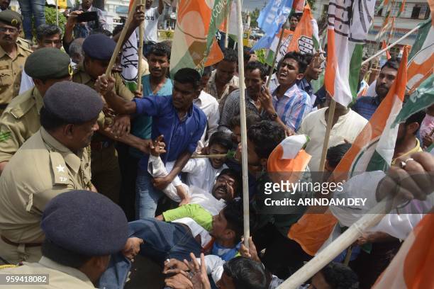 Indian National Congress supporters shout slogans during a protest rally against the decision of demolition of party's offices across the state in...