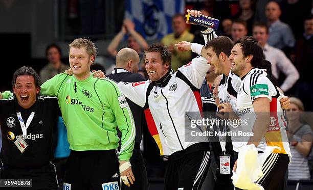 Oliver Roggisch of Germany celebrates with his team mates after the Men's Handball European Championship Group C match between Germany and Sweden at...