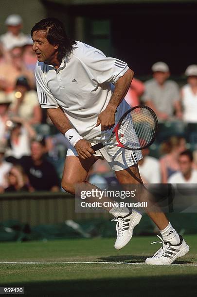 Ilie Nastase of Romania in action during the Wimbledon Lawn Tennis Seniors Championships held at the All England Lawn Tennis and Croquet Club, in...