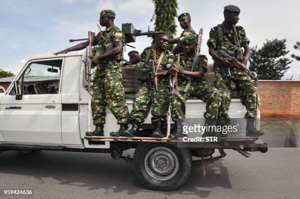 Burundi's security guards patrol near a polling station for the referendum on a controversial constitutional reform in Bujumbra, Burundi, on May 17,...
