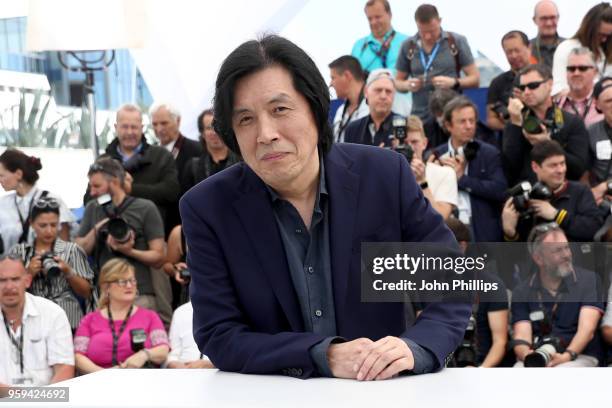 Director Chang-dong Lee attends "Burning" Photocall during the 71st annual Cannes Film Festival at Palais des Festivals on May 17, 2018 in Cannes,...