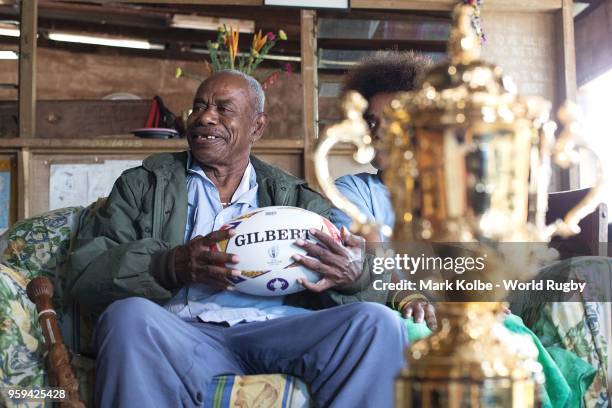 Apakuki Saisai and his family and friends sit with the Webb Ellis Cup in his house during Rugby World Cup 2019 Trophy Tour on May 17, 2018 in Galoa...