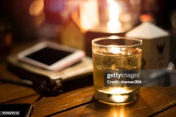 selective focus drink alcohol and water glass with whisky and sparking water and ice cube - whiskey tasting stock pictures, royalty-free photos & images
