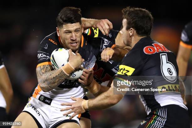 Tyrone Phillips of the Panthers is tackled during the round 11 NRL match between the Penrith Panthers and the Wests Tigers at Panthers Stadium on May...