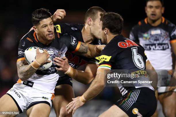 Tyrone Phillips of the Panthers is tackled during the round 11 NRL match between the Penrith Panthers and the Wests Tigers at Panthers Stadium on May...