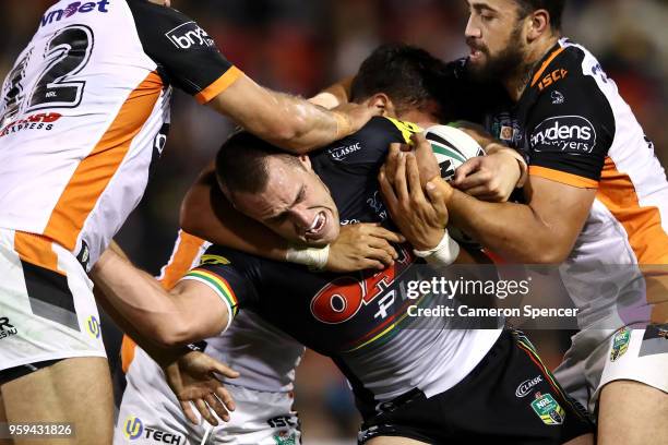 Isaah Yeo of the Panthers is tackled during the round 11 NRL match between the Penrith Panthers and the Wests Tigers at Panthers Stadium on May 17,...