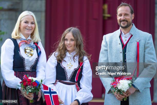 Princess Mette Marit of Norway, Princess Ingrid Alexandra of Norway and Prince Haakon Magnus of Norway greet the children's parade during the...