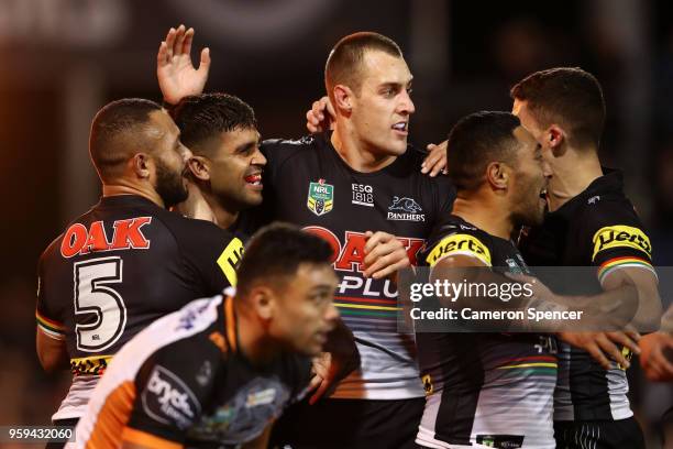 Tyrone Peachey of the Panthers celebrates scoring a try with team mates during the round 11 NRL match between the Penrith Panthers and the Wests...