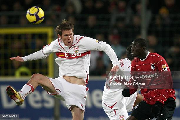 Aliaksandr Hleb of Stuttgart is challenged by Papiss Cisse of Freiburg during the Bundesliga match between SC Freiburg and VfB Stuttgart at the...
