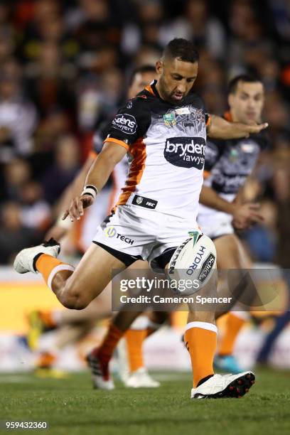 Benji Marshall of the Tigers kicks ahead during the round 11 NRL match between the Penrith Panthers and the Wests Tigers at Panthers Stadium on May...