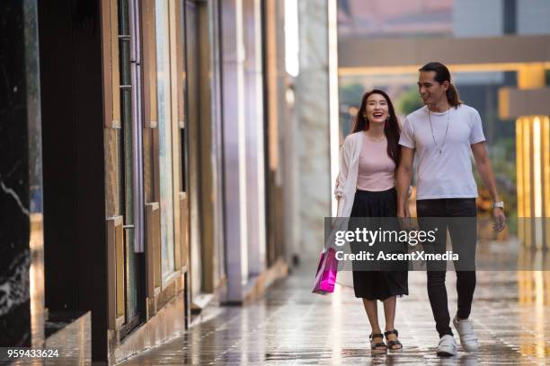 couple enjoying an evening out shopping - bukit bintang stock pictures, royalty-free photos & images