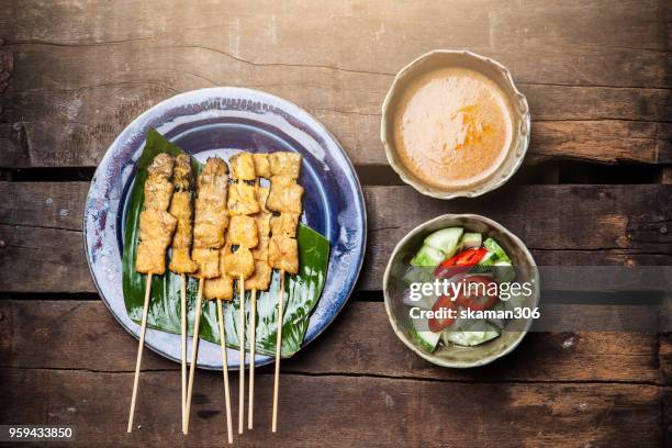 chicken satay grilled on grills plate with smoke - chicken satay stock pictures, royalty-free photos & images