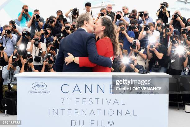 British actor Gary Oldman kisses his wife Gisele Schmidt on May 17, 2018 during a "Rendez-Vous with Gary Oldman" at the 71st edition of the Cannes...