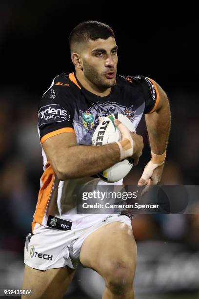 Alex Twal of the Tigers runs the ball during the round 11 NRL match between the Penrith Panthers and the Wests Tigers at Panthers Stadium on May 17,...