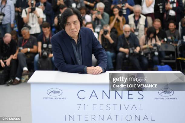 South Korean director Lee Chang-Dong poses on May 17, 2018 during a photocall for the film "Burning" at the 71st edition of the Cannes Film Festival...