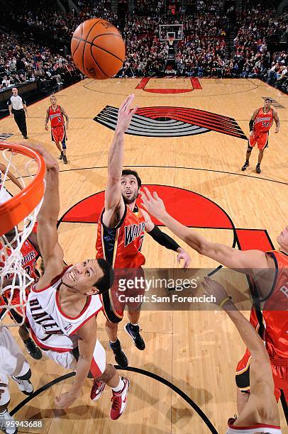 Brandon Roy of the Portland Trail Blazers and Vladimir Radmanovic the Golden State Warriors go after a loose ball during the game on January 2, 2010...