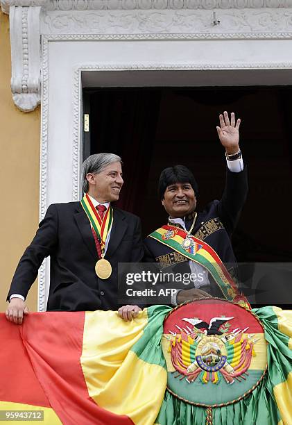 Bolivian President Evo Morales and Vice-President Alvaro Garcia Linera wave at the crowd from a balcony of the presidential palace Quemado in La Paz,...