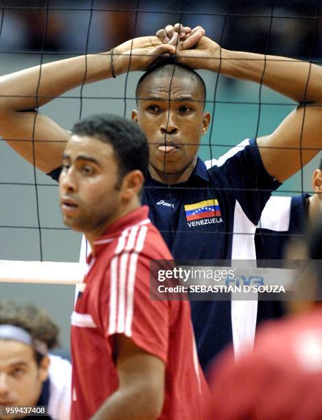 The Venezuelan Andres Manzanillo, waits with his teammate Rodman Valera, for the serve of the Egyptian player, during the third set of the match...
