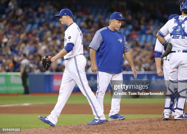 Jake Petricka of the Toronto Blue Jays exits the game as he is relieved by manager John Gibbons in the seventh inning during MLB game action against...