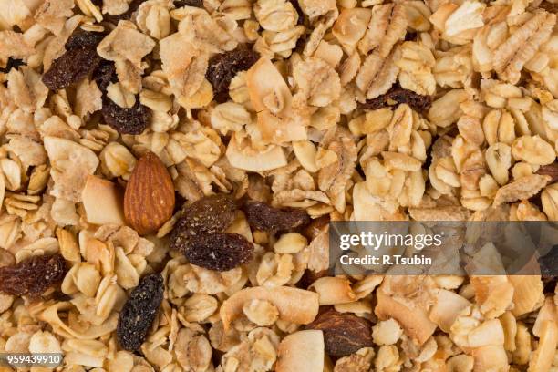 closeup of a pile of muesli cereal breakfast oatmeal - raisin bran stock pictures, royalty-free photos & images