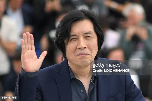South Korean director Lee Chang-Dong poses on May 17, 2018 during a photocall for the film "Burning" at the 71st edition of the Cannes Film Festival...