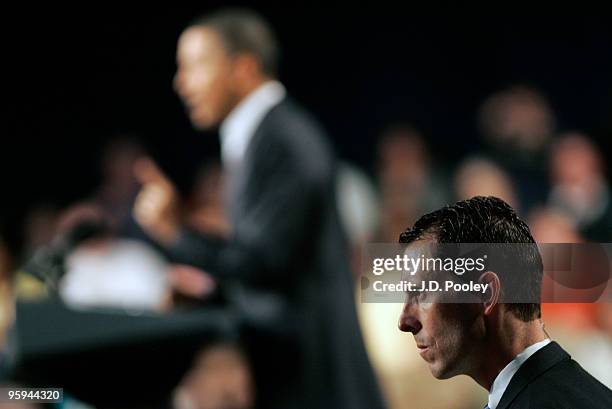 United States Secret Service Agent keeps watch while U.S. President Barack Obama speaks during a town hall meeting with Ohio students, workers, local...