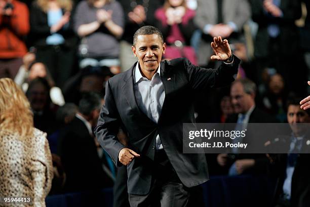 President Barack Obama arrives to speak during a town hall meeting with Ohio students, workers, local leaders and small business owners at Ewing...