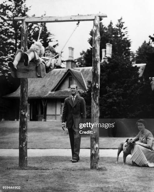Britain's Queen Elizabeth II and Prince Philip, Duke of Edinburgh play with Prince Charles and Princess Anne at Balmoral Castle in Aberdeenshire in...