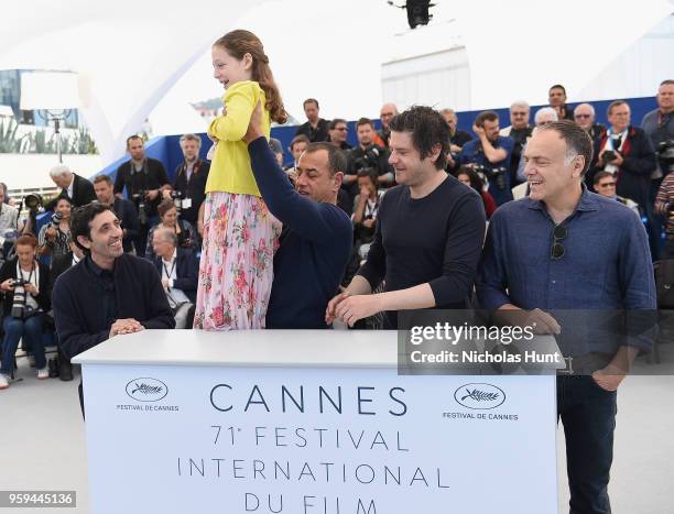 Marcello Fonte, Matteo Garrone, Alida Baldari Galabria, Edoardo Pesce and Francesco Acquaroli attend the photocall for the "Dogman" during the 71st...