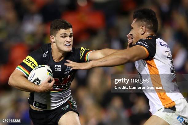 Nathan Cleary of the Panthers is tackled during the round 11 NRL match between the Penrith Panthers and the Wests Tigers at Panthers Stadium on May...