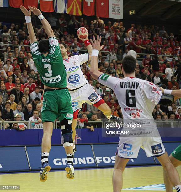 Jiri Vitek of Czech Republic vies with Ferenc Ilyes of Hungary as Vaclav Vrany stands by in Vienna, on January 22 during their Euro 2010 Group D...